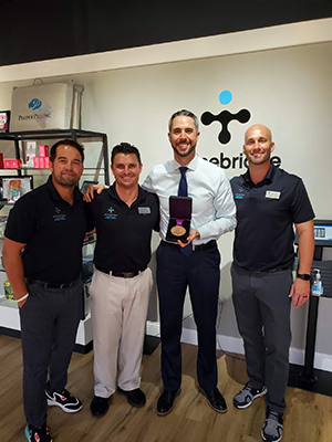 Chiropractor The Colony TX Andrew Oteo With Chiropractic Team